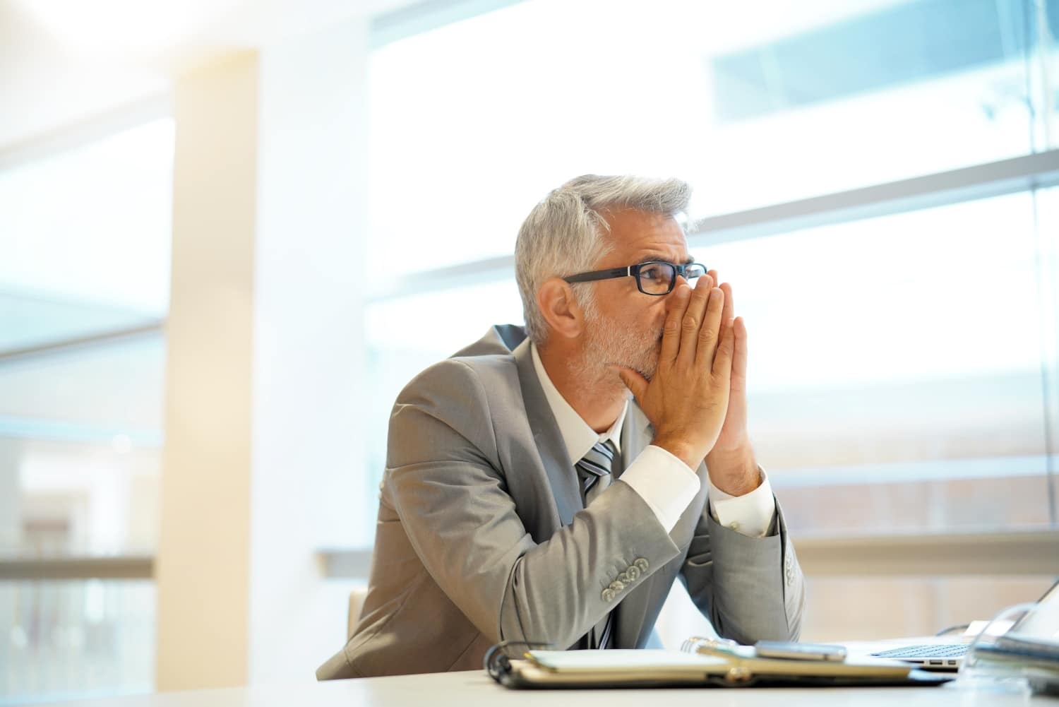 Stressed out businessman sitting at desk